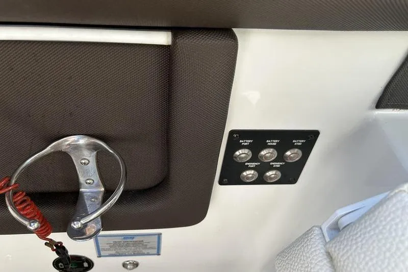 Slide: The Image of Control panel and safety features on a 2017 Cobalt R30 boat. - 5