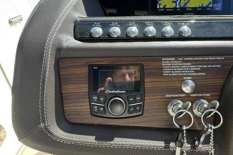 Slide: The Image of Dashboard of a 2017 Cobalt R30 boat with controls and ignition keys. - 6