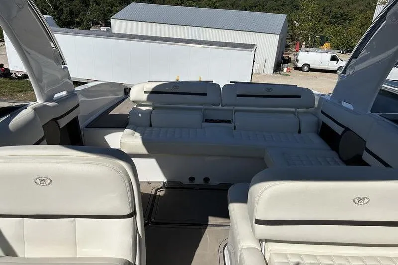 Slide: The Image of 2017 Cobalt R30 boat interior with white leather seating and outdoor view. - 8