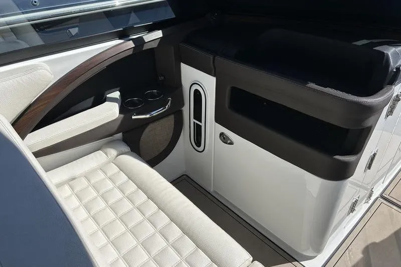 Slide: The Image of Interior of a 2017 Cobalt R30 boat with cushioned seating and storage. - 9
