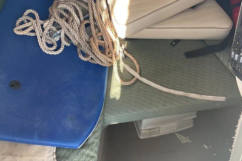 Slide: The Image of Interior of 2002 Trophy 1802 Walkaround boat with rope and seating. - 14