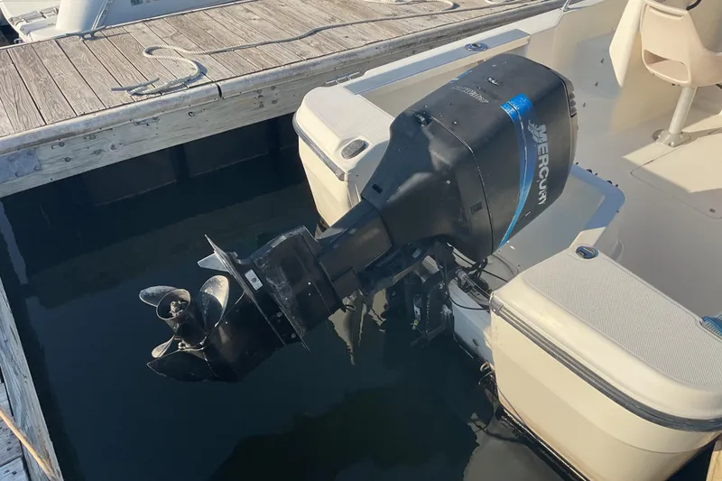 Slide: The Image of 2002 Trophy 1802 Walkaround boat with Mercury outboard motor at dock. - 15