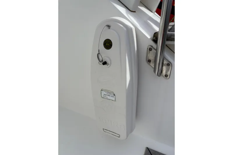 Slide: The Image of 1984 Grand Banks Classic boat detail with key and metal railing. - 20