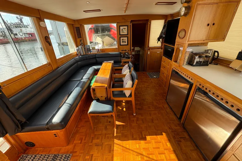 Slide: The Image of Interior of 1984 Grand Banks Classic yacht with wood finish and comfortable seating. - 22
