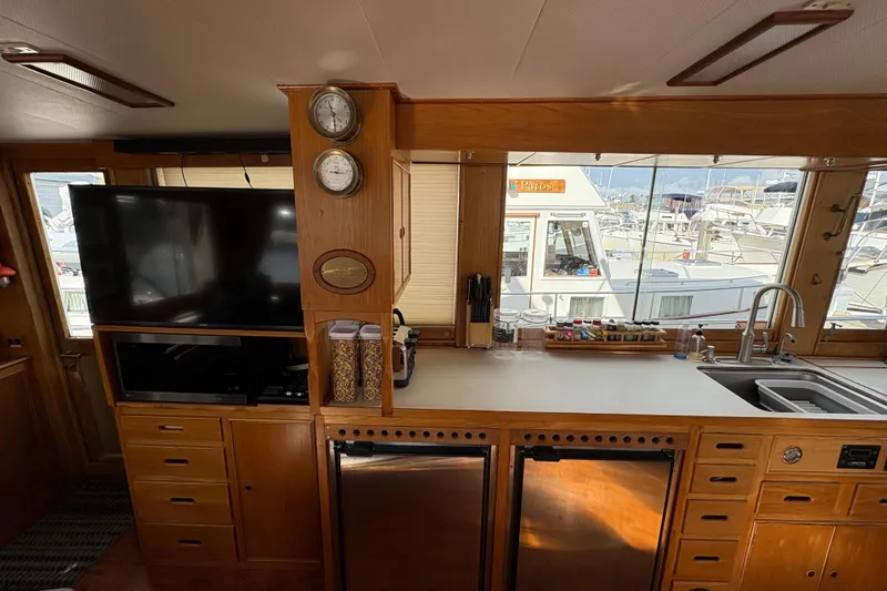 Slide: The Image of Interior of 1984 Grand Banks Classic yacht with kitchen and entertainment area. - 25