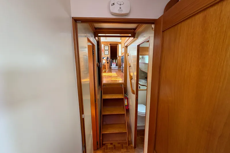Slide: The Image of Interior of 1984 Grand Banks Classic yacht with wooden stairs and hallway. - 44