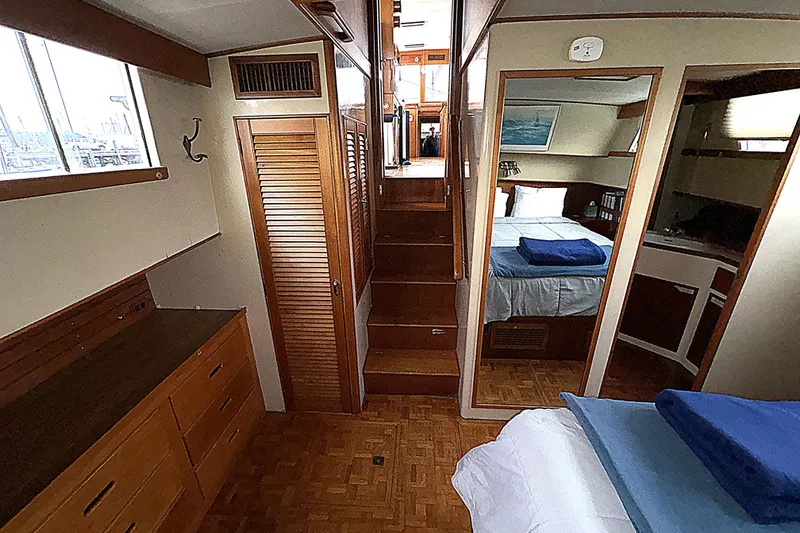 Slide: The Image of 1984 Grand Banks Classic yacht interior with wooden cabinetry and cozy bedroom. - 60