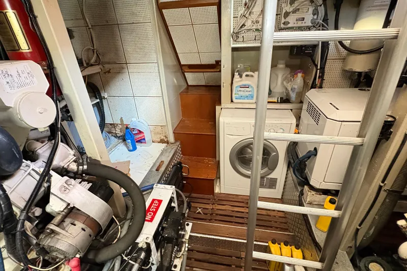 Slide: The Image of Engine room of 1984 Grand Banks 49 Classic with laundry appliances and equipment. - 73
