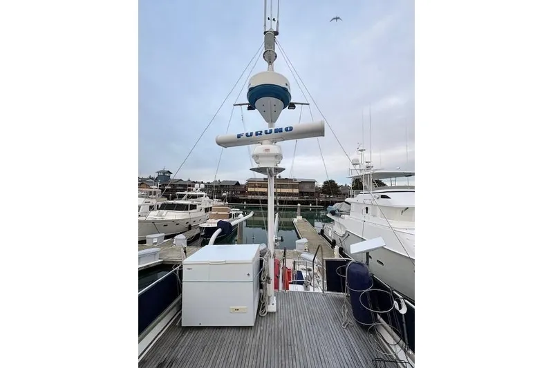 Slide: The Image of 1984 Grand Banks Classic yacht docked, featuring Furuno radar equipment. - 8