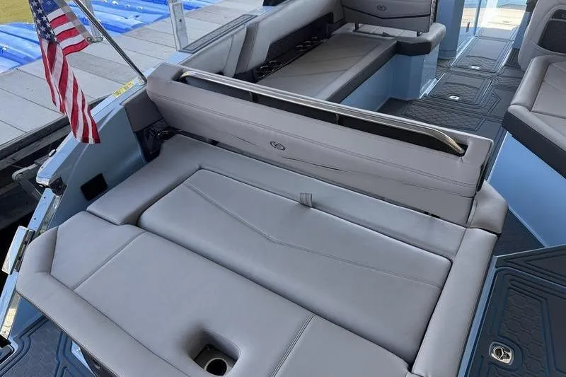 Slide: The Image of 2026 Cobalt R8 Surf boat on trailer, sleek design, light blue color. - 11