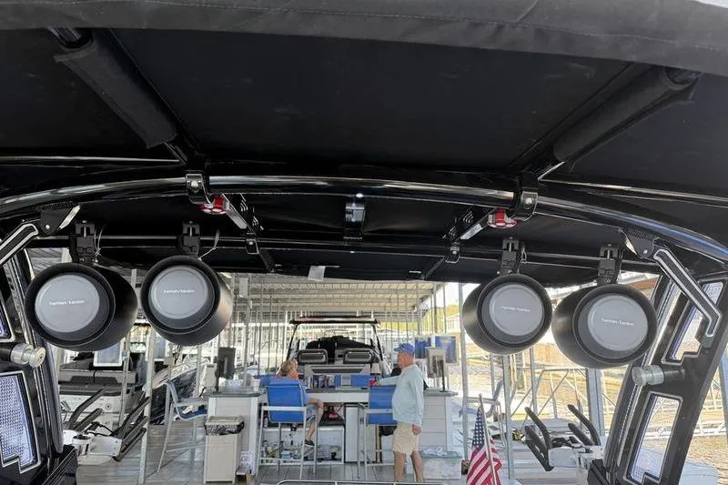 Slide: The Image of 2026 Cobalt R8 Surf boat interior with speakers and dock view. - 17