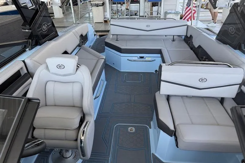 Slide: The Image of 2026 Cobalt R8 Surf boat docked, featuring spacious seating and sleek design. - 4