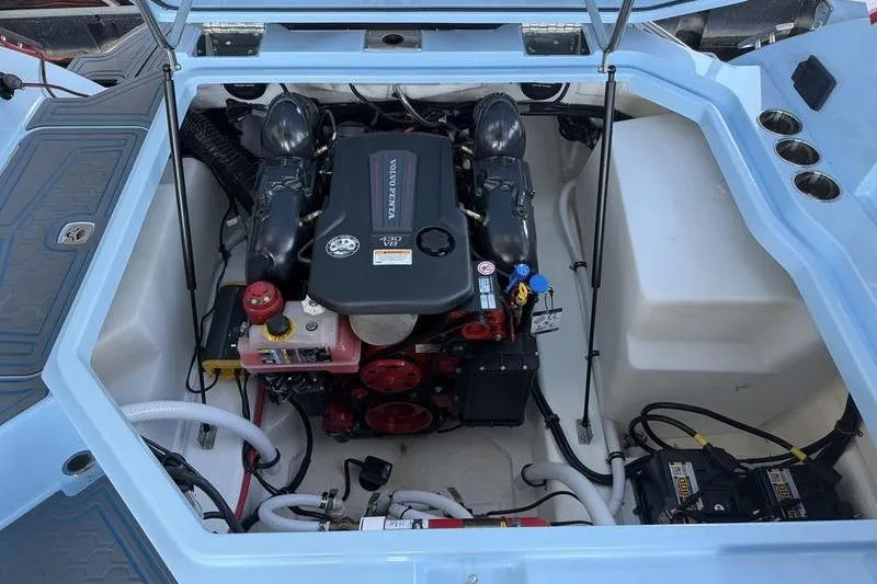 Slide: The Image of 2026 Cobalt R8 Surf boat interior with gray seating and American flag. - 6