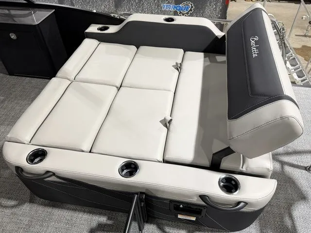 Slide: The Image of 2026 Barletta Cabrio 24UE 3T boat seating area with cup holders. - 13