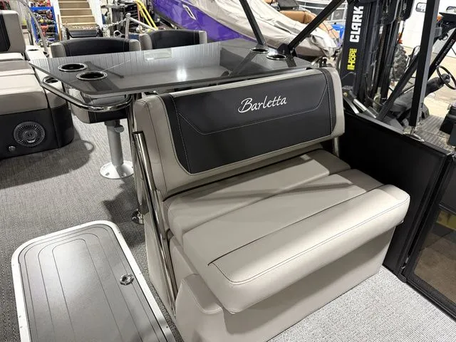 Slide: The Image of Interior of 2026 Barletta Cabrio 24UE 3T with gray seating. - 26