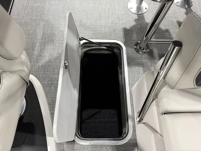 Slide: The Image of Open storage compartment in Barletta Cabrio 24UE 3T boat, 2026 model. - 27