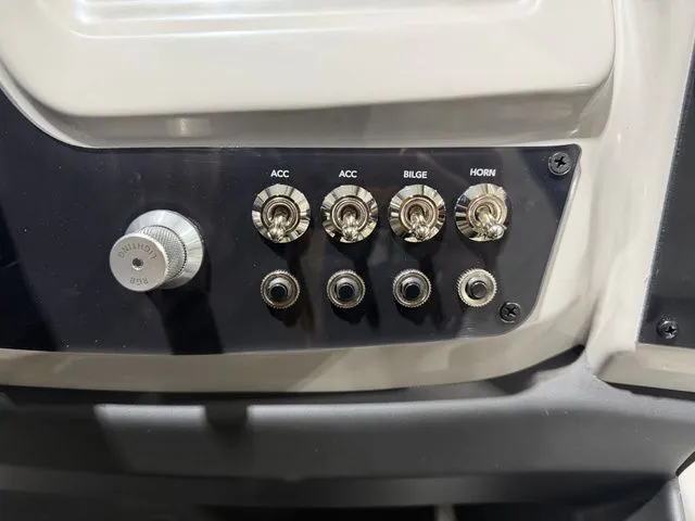 Slide: The Image of 2026 Barletta Cabrio 24UE 3T control panel with switches. - 35