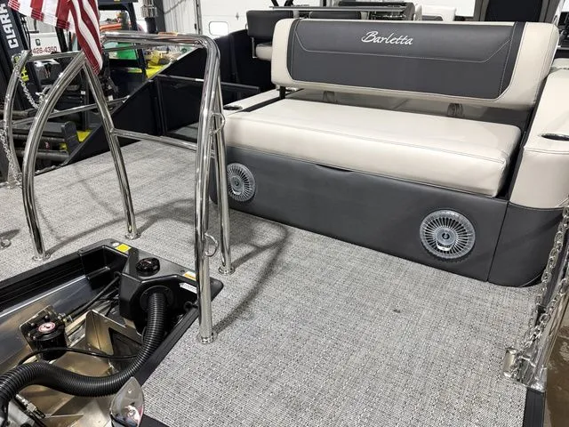 Slide: The Image of Interior of 2026 Barletta Cabrio 24UE 3T with seating and speakers. - 9