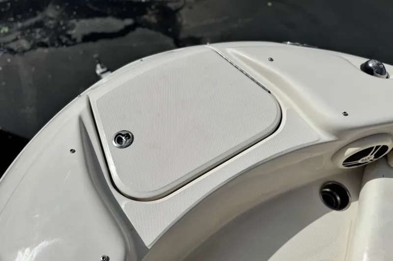 Slide: The Image of 2008 Sea Ray 200 Sundeck boat deck with storage compartment and speaker. - 14