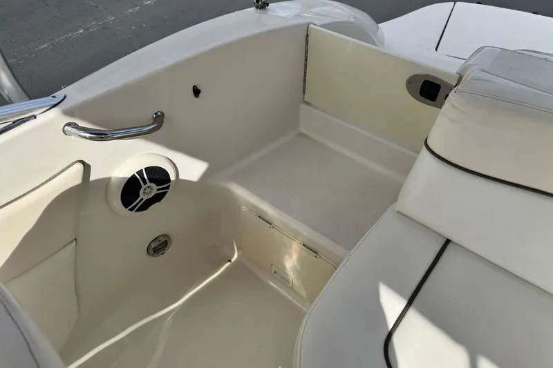 Slide: The Image of 2008 Sea Ray 200 Sundeck interior with seating and speaker detail. - 18