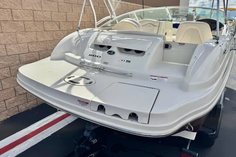 Slide: The Image of 2008 Sea Ray 200 Sundeck boat, rear view, showcasing seating and swim platform. - 6