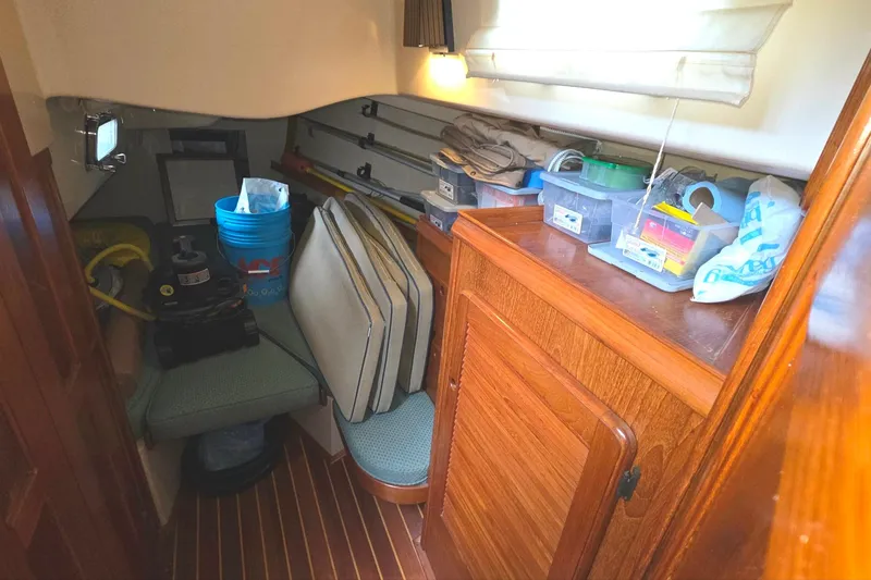 Slide: The Image of Interior of 1989 Island Packet 38 sailboat with storage and equipment. - 14