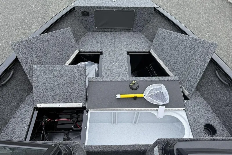 Slide: The Image of 2026 Lund 1650 Rebel SS dashboard with steering wheel and gauges. - 9