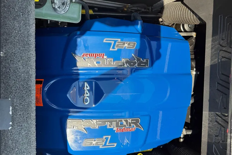 Slide: The Image of 2017 Supra SA450 boat interior with red and gray seating, featuring modern design and audio system. - 13