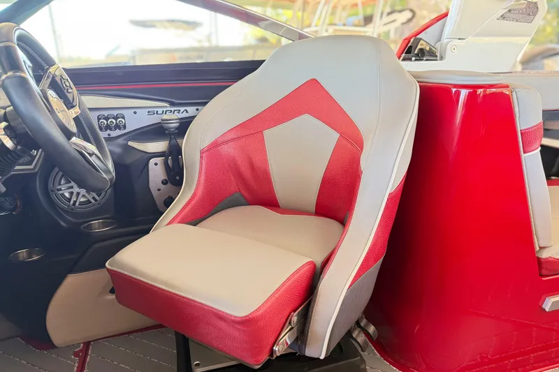 Slide: The Image of 2017 Supra SA450 interior with red and gray seating, steering wheel, and dashboard controls. - 15
