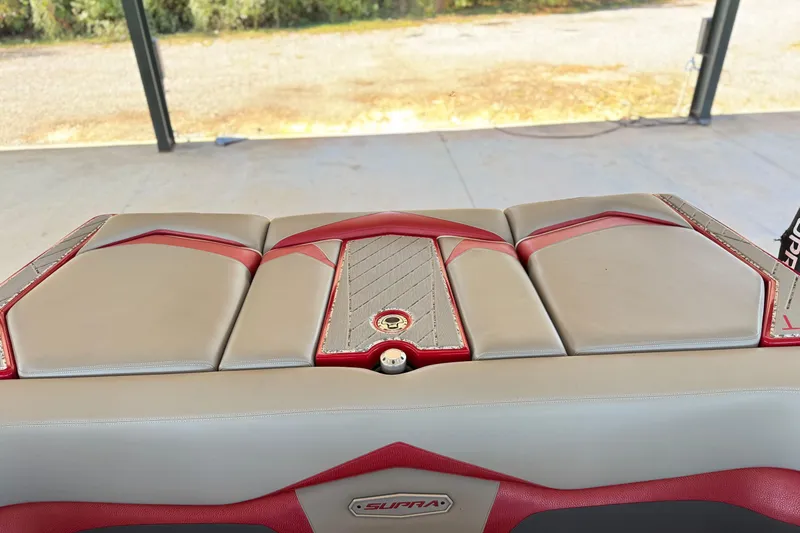 Slide: The Image of 2017 Supra SA450 boat interior with beige and red upholstery. - 27