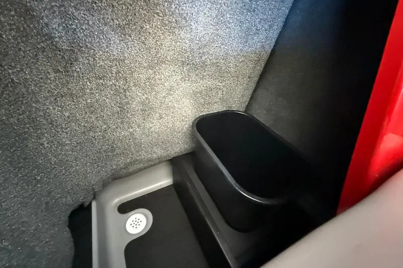 Slide: The Image of Interior of 2017 Supra SA450, featuring a storage compartment and drain. - 30