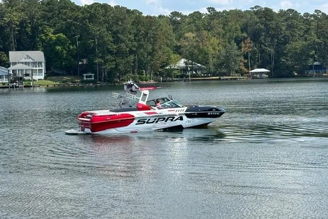 Slide: The Image of Red 2017 Supra SA450 boat with Raptor engine and Swell Surf system. - 4