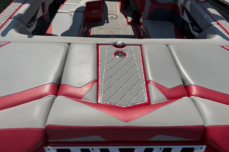Slide: The Image of 2017 Supra SA450 boat with red and black design under a metal canopy. - 7
