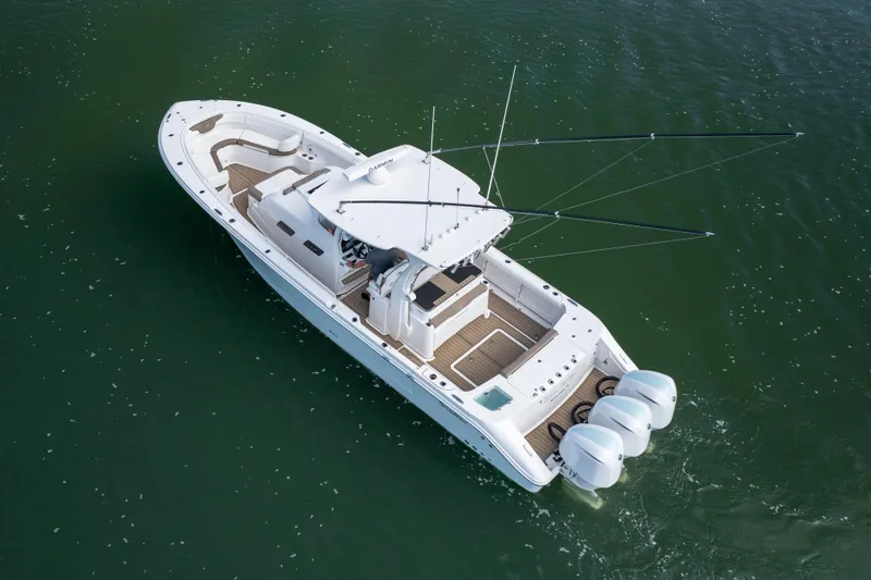 Slide: The Image of Aerial view of 2021 Edgewater 370CC boat cruising on water. - 37