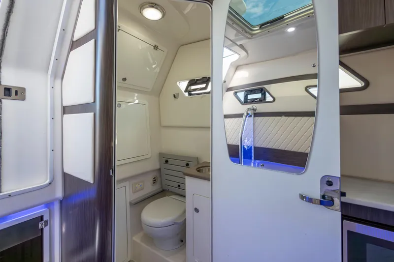 Slide: The Image of Luxurious interior of 2021 Edgewater 370CC boat featuring modern bathroom amenities. - 45