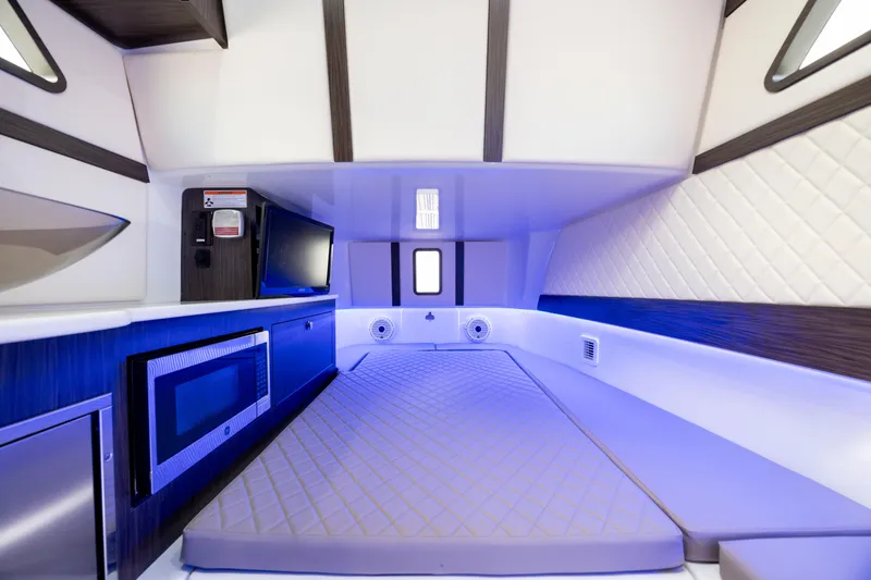 Slide: The Image of Luxurious interior of 2021 Edgewater 370CC boat with modern amenities and ambient lighting. - 49