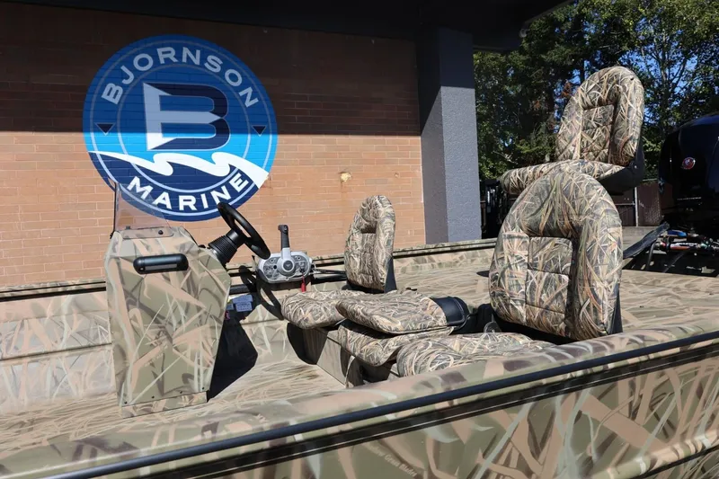 Slide: The Image of 2026 Lowe Roughneck RX2070 SC boat with camo seats at Bjornson Marine. - 27