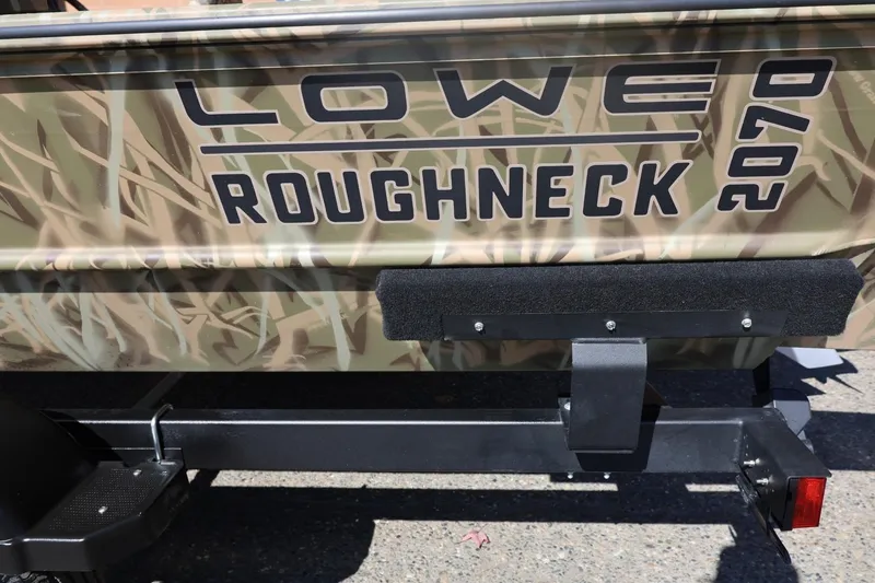 Slide: The Image of 2026 Lowe Roughneck RX2070 SC boat with camouflage design on trailer. - 28