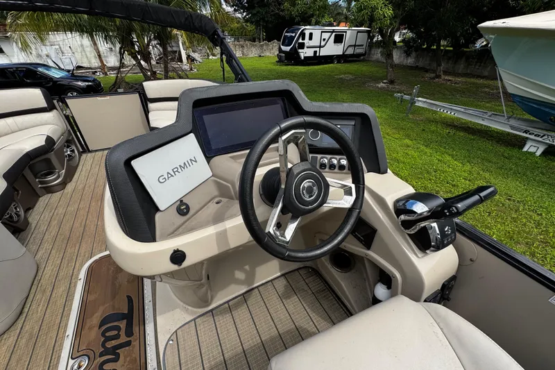 Slide: The Image of 2023 Tahoe Pontoon Cascade Platinum Quad Lounger dashboard with Garmin navigation system. - 20