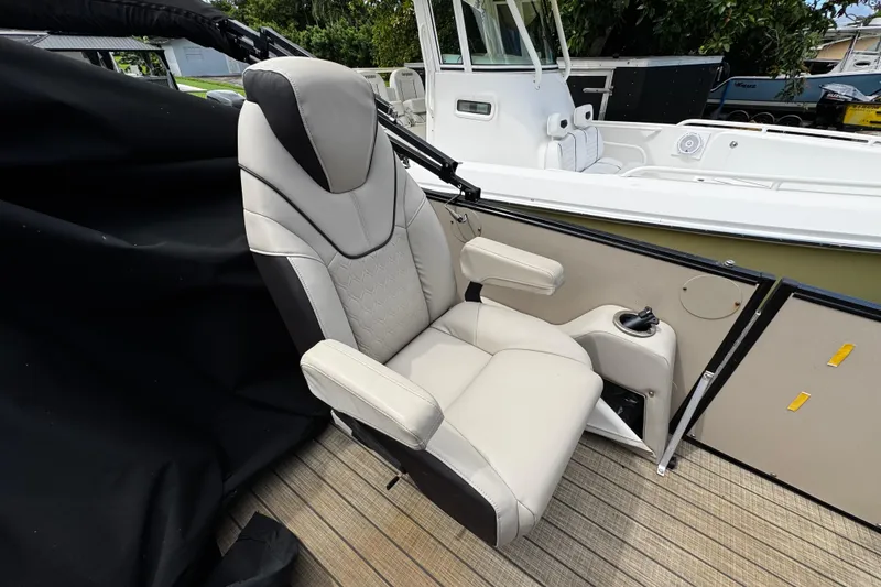 Slide: The Image of 2023 Tahoe Pontoon Cascade Platinum Quad Lounger seat, beige leather, on deck. - 22