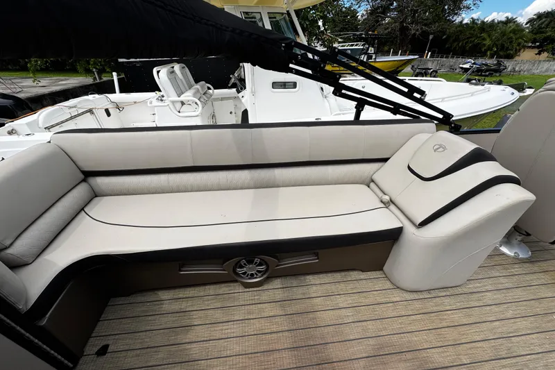 Slide: The Image of 2023 Tahoe Pontoon Cascade Platinum Quad Lounger interior with luxurious seating and sleek design. - 26