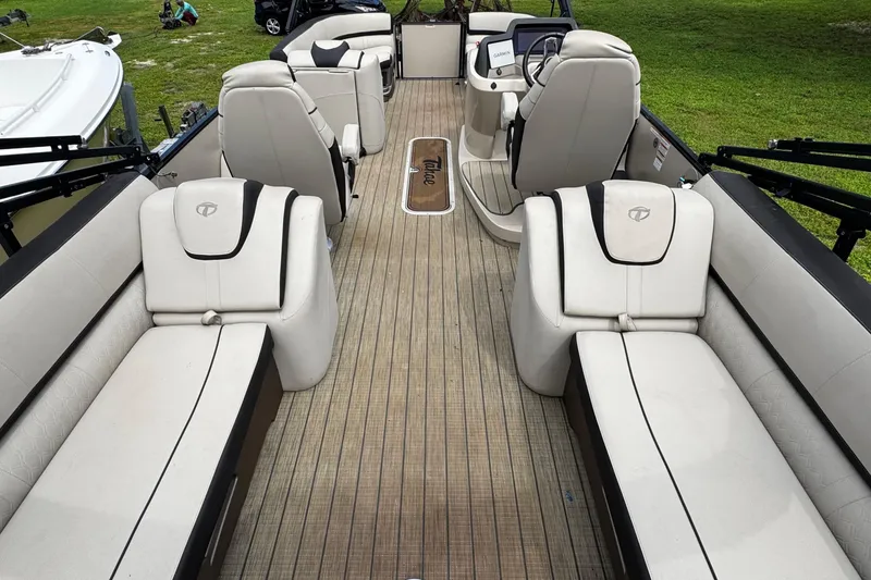 Slide: The Image of 2023 Tahoe Pontoon Cascade Platinum Quad Lounger interior with luxurious seating and modern design. - 31