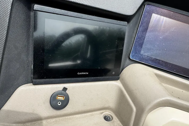 Slide: The Image of Dashboard of 2023 Tahoe Pontoon Cascade Platinum with Garmin display and USB port. - 37