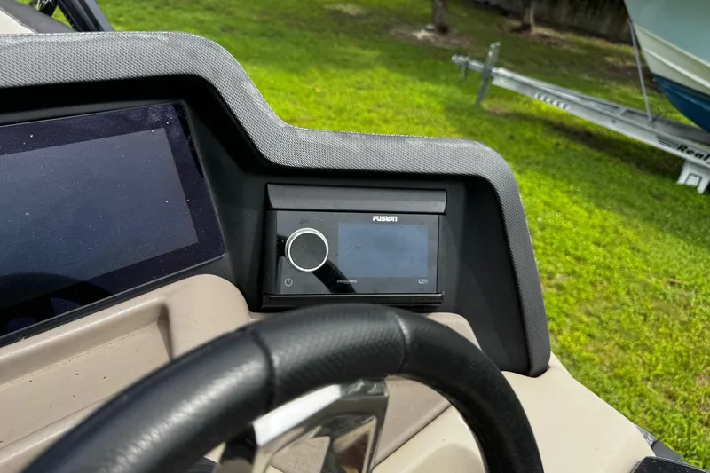 Slide: The Image of 2023 Tahoe Pontoon Cascade Platinum dashboard with Fusion stereo system. - 39
