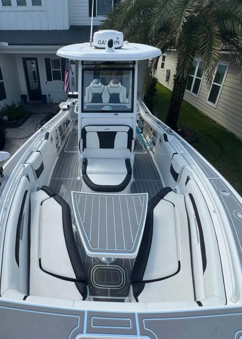 Slide: The Image of 2022 Tidewater 272 CC Adventure boat with sleek seating and modern design. - 10