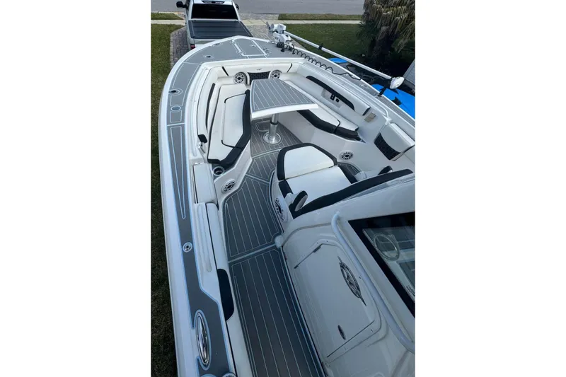 Slide: The Image of 2022 Tidewater 272 CC Adventure boat interior with sleek seating and modern design. - 11
