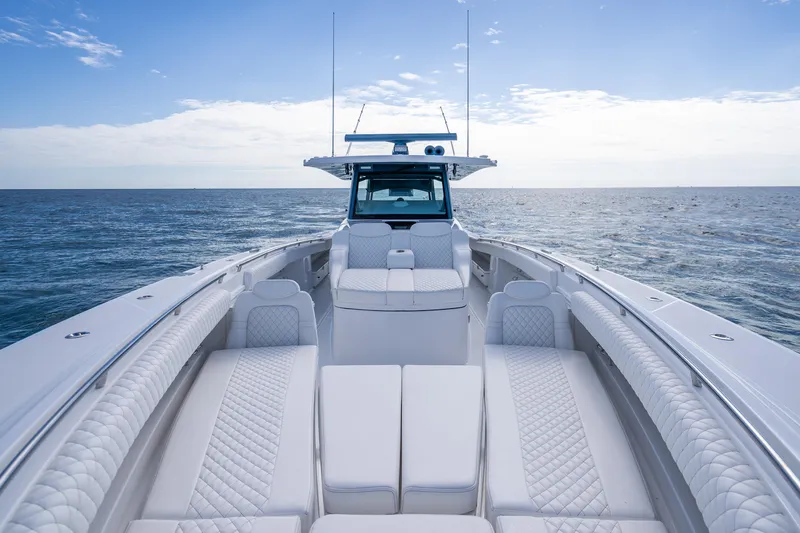 Slide: The Image of Luxury 2026 HCB 53 Suenos RXV boat with elegant seating on open water. - 11