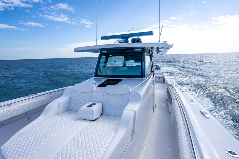 Slide: The Image of 2026 HCB 53 Suenos RXV luxury boat cruising on open sea. - 12