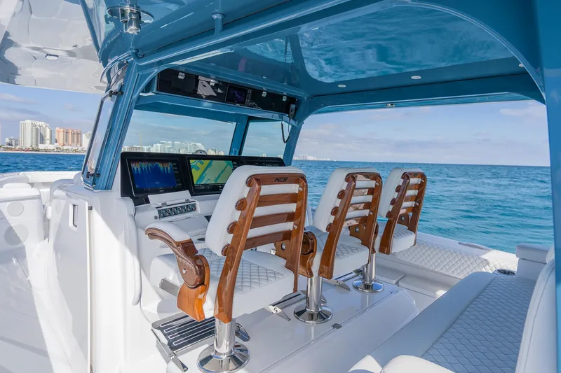 Slide: The Image of 2026 HCB 53 Suenos RXV boat interior with luxury seating and advanced navigation displays. - 22