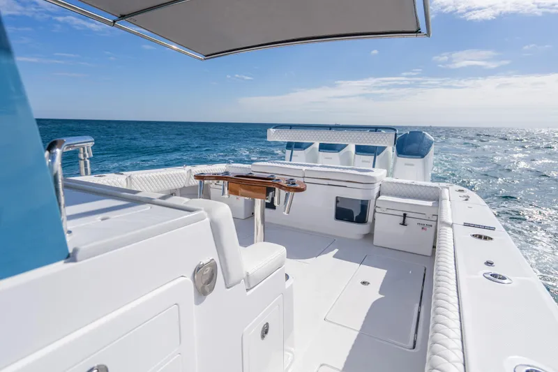 Slide: The Image of Luxury HCB 53 Suenos RXV 2026 boat cruising on open sea under clear skies. - 23